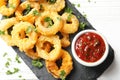 Homemade crunchy fried onion rings with tomato sauce Royalty Free Stock Photo
