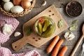 Homemade cucumber pickles or gherkins in a glass jar on a table, top view Royalty Free Stock Photo