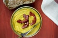 Homemade curry hummus with capsicum garnish