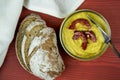 Homemade curry hummus and rustic sliced bread