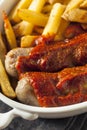 Homemade Currywurst and French Fries Royalty Free Stock Photo