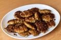 Homemade cutlets,meatballs white plate on a table yellow background.Delicious homemade cutlets.Selective focus