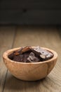 Homemade dark chocolate with almonds in wood bowl Royalty Free Stock Photo