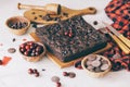 Homemade dark chocolate cherry brownie cake and sweet fresh cherries and delicious chocolate pieces in soft-focus. Royalty Free Stock Photo