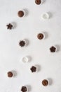 Homemade dark and milk chocolate pralines candies on white background. Top view. Chocolatier work