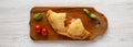 Homemade Deep Fried Italian Panzerotti Calzone with sauce on a rustic wooden board, overhead view. Flat lay, top view, from above Royalty Free Stock Photo