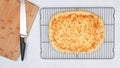 Homemade delicious flat bread with mozzarella cheese topping close up on cooling rack Royalty Free Stock Photo