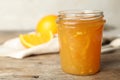 Homemade delicious orange jam on wooden table Royalty Free Stock Photo