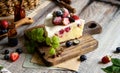 Homemade delicious slice of raspberry biscuit cake with white cream, strawberries, blueberries Royalty Free Stock Photo