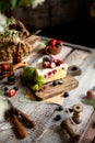 Homemade delicious slice of raspberry biscuit cake with white cream, strawberries, blueberries Royalty Free Stock Photo