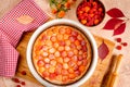 Homemade delicious sweet apricot pie served with raspberries on a table, top view Royalty Free Stock Photo