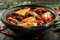 Tasty seafood curry in clay pot