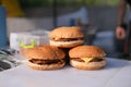 Homemade delicious three mini burgers served with salad, sauce and french fries Royalty Free Stock Photo