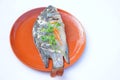 Homemade dilicious steamed fish on brown plate. Original thai food.Healthy and high protine food Royalty Free Stock Photo