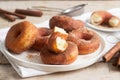 Homemade donuts with sugar and cinnamon on a wooden background. Rustic style Royalty Free Stock Photo