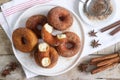 Homemade donuts with sugar and cinnamon on a wooden background. Rustic style Royalty Free Stock Photo