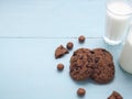 Homemade double chocolate chip cookies on blue wooden background with glass of milk. Royalty Free Stock Photo