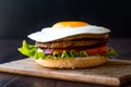 Homemade Double Hamburger with Egg, Lettuce and Tomatoes.