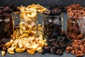 Homemade dried apples, plums, pears and apricots in glass jars, Traditional drying fruits at home, to keep vitamins for cooking