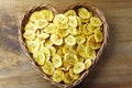 Homemade dried banana chips in rustic basket Royalty Free Stock Photo