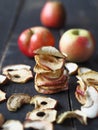Homemade dried fruit Apple chips on a rustic wooden dark table. Natural healthy food.The benefits of dried fruit Royalty Free Stock Photo