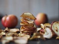 Homemade dried fruit Apple chips on a rustic wooden dark table. Natural healthy food.The benefits of dried fruit Royalty Free Stock Photo