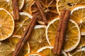 Homemade dried fruits slices of orange cinnamon sticks food pattern. New year Christmas decoration elements