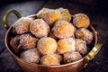 Homemade dumplings in antique copper pot, Traditional Croatian cookies called Fritule