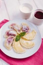 Homemade dumplings with cherries and cottage cheese