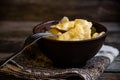 Homemade dumplings in clay pots on the kitchen table, fork and folklor napkin. Royalty Free Stock Photo