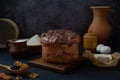 Homemade easter cake rises in a rustic kitchen, surrounded by utensils and essential baking ingredients like flour, sugar, eggs, Royalty Free Stock Photo