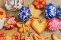 Homemade easter confectionery sugar shaped to butterfly with painted eggs on wood background