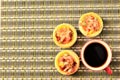 Homemade egg tart pizza and red cup coffee bakcgrounds above