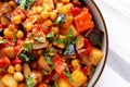 Homemade Eggplant Potato Tomato Stew with Parsley in a Bowl, top view. Flat lay, overhead, from above