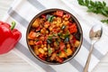 Homemade Eggplant Potato Tomato Stew with Parsley in a Bowl, top view. Flat lay, overhead, from above