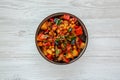 Homemade Eggplant Potato Tomato Stew with Parsley in a Bowl, top view. Flat lay, overhead, from above