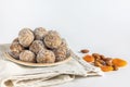 Healthy sweet food. Energy balls in a plate on a white background