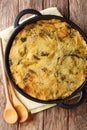 Homemade English Bubble & Squeak of baked mashed potatoes with cabbage and Brussels sprouts in a pan on the table. Vertical top Royalty Free Stock Photo