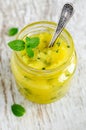 Homemade exfoliating face and body scrub with sugar, honey, lemon, olive oil and mint. DIY cosmetics and spa recipe.   Copy space Royalty Free Stock Photo