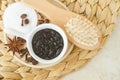 Homemade exfoliating foot and body aroma coffee scrub and wooden hairbrush. Natural beauty treatment and spa recipe.