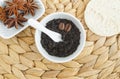 Homemade exfoliating foot and body aroma scrub with ground coffee, olive oil and star anise. Natural beauty treatment and spa