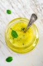 Homemade exfoliating scrub for face and body with sugar, honey, lemon, olive oil and mint. DIY cosmetics and spa recipe Royalty Free Stock Photo