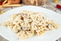 Homemade farfalle pasta with mushroom creamy sauce