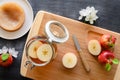 Homemade fermented kombucha or cider in a jar and cut apples on a cutting board. Top view, horizontal orientation.