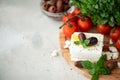 homemade feta cheese with olive oil, tomatoes and basil Royalty Free Stock Photo