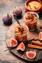 Homemade fig jam or jelly in a jar with cinnamon, vanilla and brown sugar