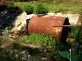 Homemade fish catcher on the slope of the pond dam Royalty Free Stock Photo