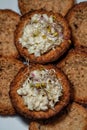 Homemade fish paste tarts with red onion sprouts on top Royalty Free Stock Photo