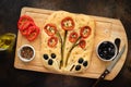 Homemade flower art focaccia on wooden cutting board