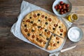 Homemade focaccia with black olives, cherry tomatoes, rosemary and salt Royalty Free Stock Photo